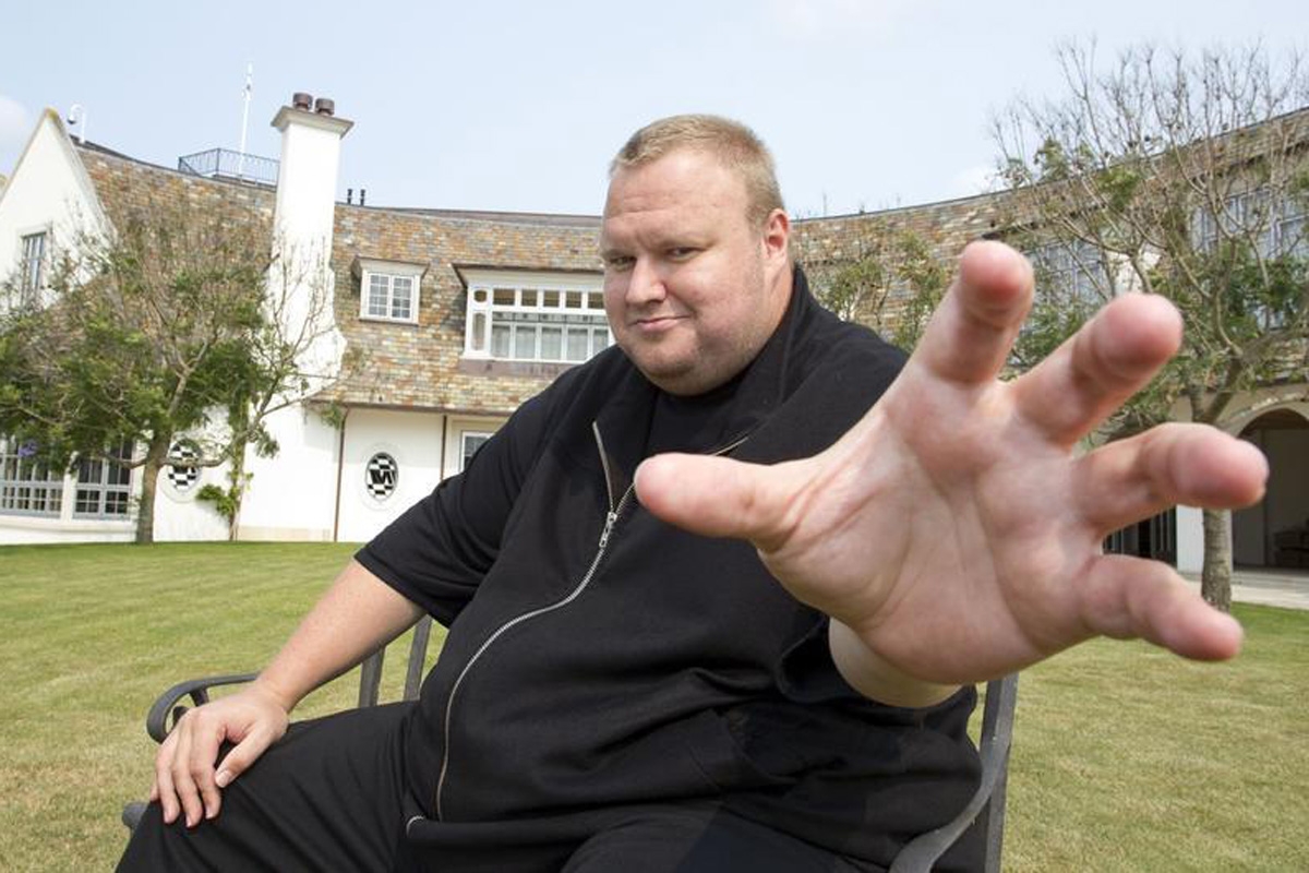 Kim Dotcom gestures towards a camera after an interview with Reuters in Auckland January 19, 2013. Dotcom is launching his new cloud storage service "Mega" at his Dotcom Mansion in Coatsville, Auckland on Sunday.  REUTERS/Nigel Marple (NEW ZEALAND - Tags: SCIENCE TECHNOLOGY BUSINESS) - RTR3CMN9
